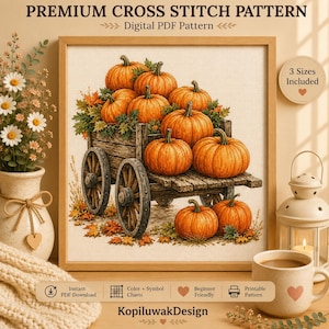 Puede incluir: Un patrón de punto de cruz digital que muestra una carreta de madera llena de calabazas naranjas y hojas de otoño. El diseño incluye el texto PREMIUM CROSS STITCH PATTERN, Digital PDF Pattern, 3 Sizes Included y KopiluwakDesign.