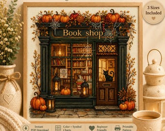 以下が含まれることがあります： カボチャ、秋の葉、クモの巣で飾られた本屋の店先を描いたクロスステッチパターン。デザインには、ドアのところにいる黒猫、光るランタン、ガラス窓から見える本棚が含まれています。