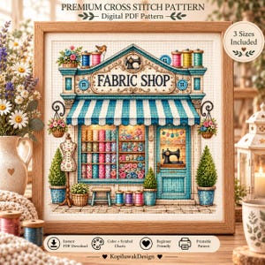 May include: A framed cross stitch pattern depicting a fabric shop with a blue and white striped awning, shelves filled with colorful fabric bolts, spools of thread, a sewing machine, and a mannequin. The text reads PREMIUM CROSS STITCH PATTERN.