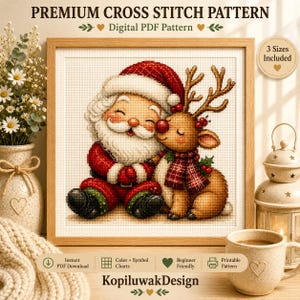 May include: A digital cross stitch pattern featuring a smiling Santa Claus and a reindeer with a red nose, wearing a plaid scarf. The text reads PREMIUM CROSS STITCH PATTERN, Digital PDF Pattern, 3 Sizes Included, and KopiluwakDesign.