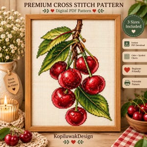 Könnte beinhalten: Ein digitales Kreuzstichmuster mit einer Gruppe leuchtend roter Kirschen und grünen Blättern auf hellem Grund, gerahmt in Holz. Der Text lautet PREMIUM CROSS STITCH PATTERN, Digital PDF Pattern, 3 Sizes Included und KopiluwakDesign.
