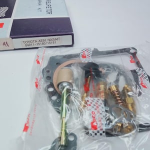 May include: A rustic wooden sign with the text "Welcome to our home" in white lettering. The sign features a distressed finish and a simple, inviting design, perfect for a front porch or entryway.