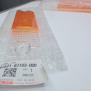 Lente de intermitente delantero original Daihatsu 81521-87103-000 Taft Rocky Feroza