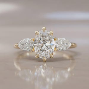 Oval Lab Grown Diamond Engagement Ring: 14K Yellow Gold Pear Side Stones
