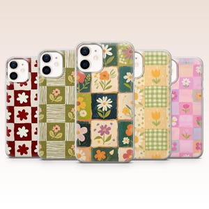 May include: Five phone cases with floral designs. The cases feature various patterns, including checkered and patchwork designs with daisies, tulips, and other flowers in shades of red, green, yellow, and pink.