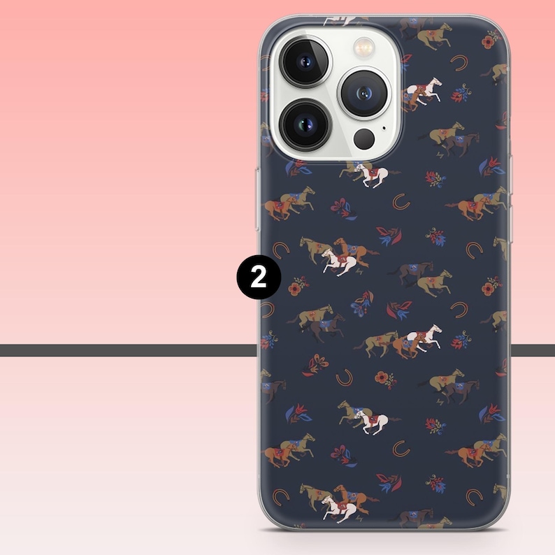 May include: A navy blue phone case featuring a repeating pattern of horses in various colors, horseshoes, and floral accents. The case has a clear border and a camera cutout. The number "2" is printed on the side.