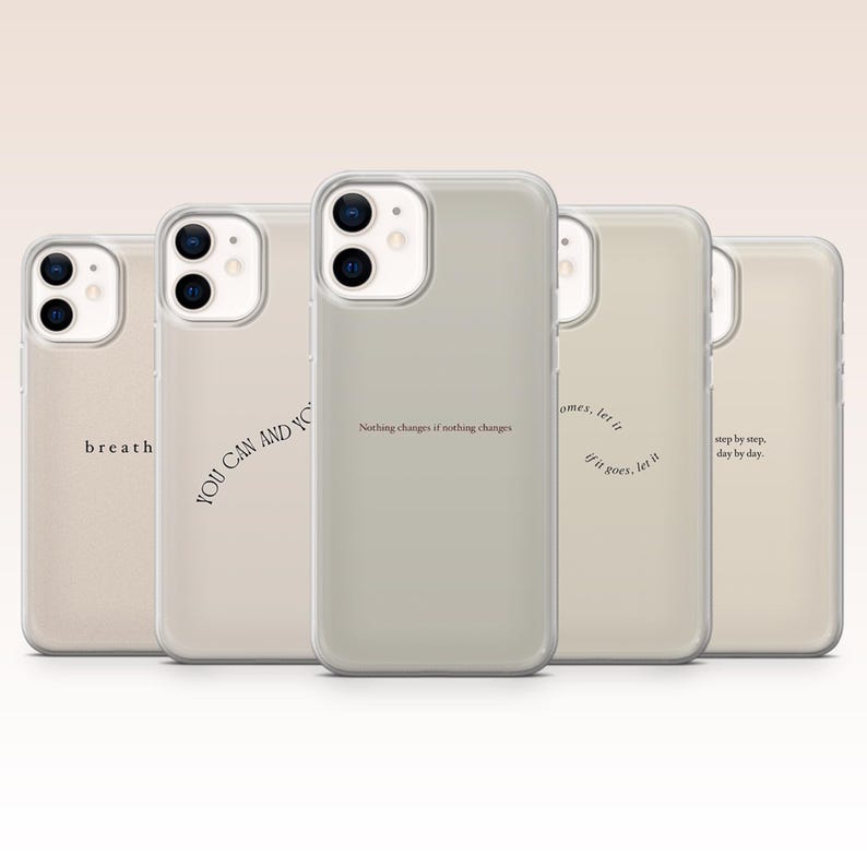 May include: A collection of five phone cases with inspirational quotes in a neutral color palette. The cases feature phrases like "breath", "YOU CAN AND YO", and "Nothing changes if nothing changes". Each case has a clear, protective cover.