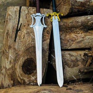 Handmade He Man sword set displayed on wooden table fantasy collector piece Masters of the Universe inspired