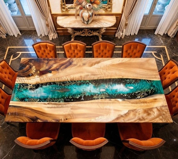 A river of deep burgundy resin flows through a raw live-edge slab — furniture as sculpture, no two alike.
