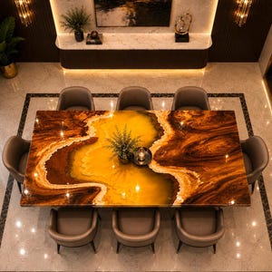 May include: A rectangular dining table featuring a polished surface with swirling patterns of deep brown, amber, and bright yellow, surrounded by eight grey upholstered chairs with curved backrests, arranged in a symmetrical dining room setting.