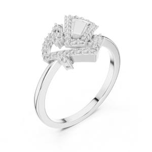 May include: A silver ring with a unique design. The ring features a central rectangular stone surrounded by smaller, sparkling stones. The band is smooth and polished, creating a modern and elegant look. The ring is set against a white background.