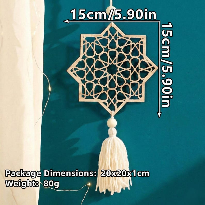 May include: A wooden star-shaped wall hanging with an intricate geometric design, measuring 5.90 inches (15 cm) on each side. It features a white tassel and bead embellishment, hanging against a teal background.