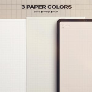 May include: Three sheets of grid paper in classic white, vintage cream, and blush pink. The text "3 PAPER COLORS" is above the paper, with "classic, vintage, blush" below. A digital tablet is on the right.