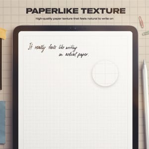 May include: A digital tablet with a grid-lined screen, featuring the text "PAPERLIKE TEXTURE" and "It really feels like writing on actual paper." A white stylus and a paperclip are visible.