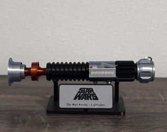 Empuñadura de sable de luz de Obi Wan Kenobi Episodio V Obi Wan Una Nueva Esperanza Empuñadura de sable de luz fiel a la pantalla Star Wars Empuñadura de sable de luz de Obi Wan Cosplay