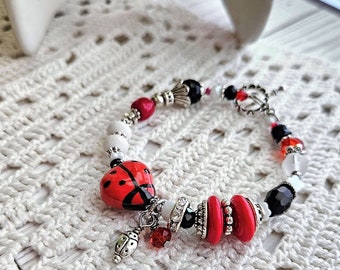 Ladybug jewelry, Memory wire bracelet, Black red ladybugs, Lost loved one, asymmetrical beaded, ceramic glass crystal shell, *NEW* flower