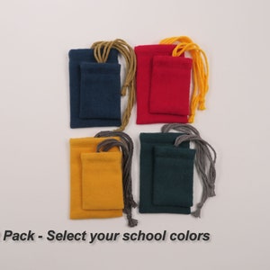 May include: Four small drawstring bags in different colors: navy blue, red, yellow, and green. The bags are arranged in a square pattern. The text "2 Pack - Select your school colors" is at the bottom of the image.