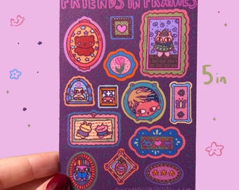 May include: A purple sticker sheet with the text "FRIENDS IN FRAMES" and various framed cartoon characters. The sticker sheet is 5 inches tall and 3.25 inches wide. The background is a light purple color with small cat and star illustrations.