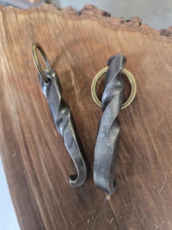 A real blacksmith hammered this keychain bottle opener from steel — 142 fans prove people want a pocket-sized piece of functional forge work.