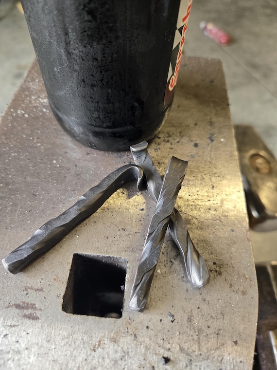 A blacksmith actually hammered this bottle opener by hand — raw, rustic, and built to outlive every trendy kitchen gadget you own.