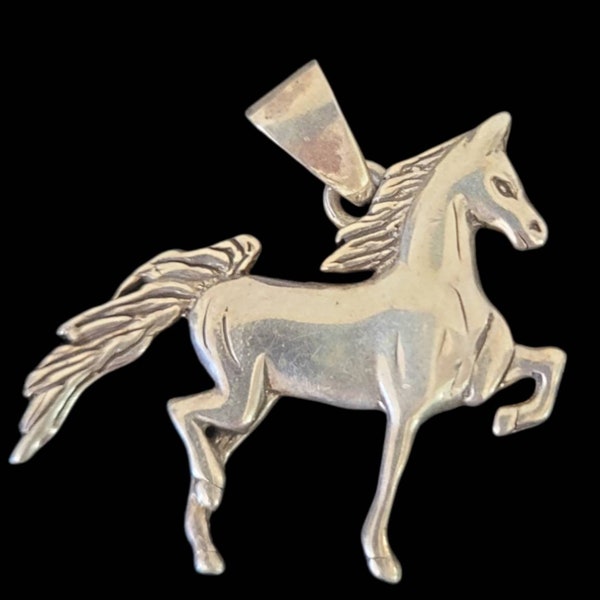 Sterling Silver Prancing Horse Pendant. Navajo Silversmiths Glenn & Irene Sandoval. No Chain. Dancing Horse. 1 3/4 inches by 1 inch.