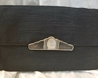 Vintage kuvertväska från 1940-talet. Äkta kord. Lucite-spänne. Svart. Innerficka.