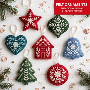 May include: Seven felt ornaments with white embroidery designs including a star, heart, house, bell, tree, circle, and onion shape. Text in the upper right corner reads: FELT ORNAMENTS EMBROIDERY DESIGNS 7 - PDF SVG PATTERN. Each ornament has a white ribbon loop.