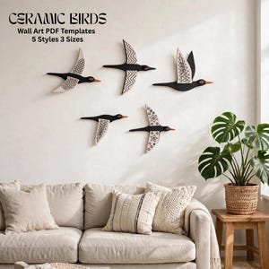 May include: Five black and white bird wall art pieces with orange beaks displayed on a wall. The text reads CERAMIC BIRDS Wall Art PDF Templates 5 Styles 3 Sizes. Each bird features distinct geometric patterns on its wings and body.