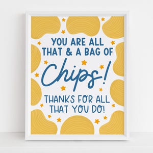 May include: A framed print with a white border features a white background with yellow potato chip illustrations and orange stars. The text reads "YOU ARE ALL THAT & A BAG OF Chips! THANKS FOR ALL THAT YOU DO!" in blue and black.