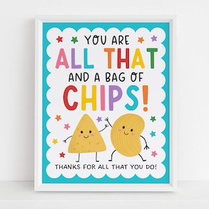 May include: A framed print with a white border features the text "YOU ARE ALL THAT AND A BAG OF CHIPS!" in colorful letters. Two cartoon chips with arms and legs are smiling below the text. The phrase "THANKS FOR ALL THAT YOU DO!" is at the bottom.