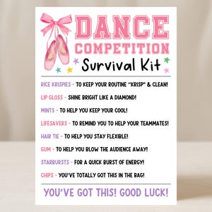 May include: A white card with pink text that reads "DANCE COMPETITION Survival Kit." The card features a pink bow, ballet shoes, and a list of items like lip gloss and mints. The phrase "You've got this! Good luck!" is at the bottom.