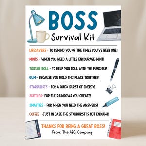 May include: A Boss Survival Kit card with illustrations of a desk lamp, coffee mug, laptop, pen, binder clip, and notepad. Text includes "BOSS Survival Kit" and various encouraging phrases for a boss.