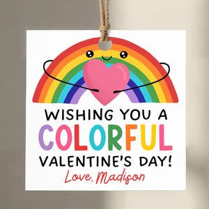 May include: A white Valentine's Day gift tag with a rainbow and a pink heart illustration. The tag reads "Wishing You a Colorful Valentine's Day! Love, Madison."