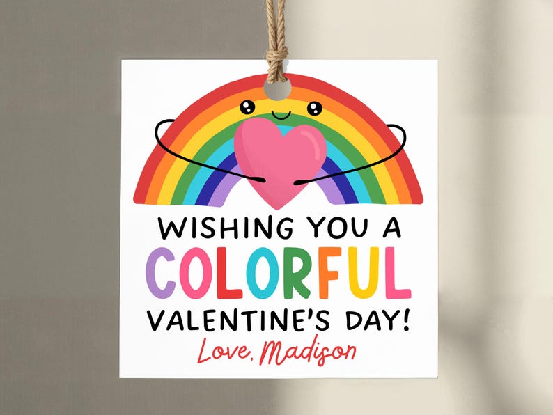 May include: A white Valentine's Day gift tag with a rainbow and a pink heart illustration. The tag reads "Wishing You a Colorful Valentine's Day! Love, Madison."