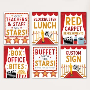 May include: Six movie-themed signs with red and gold accents. The signs include text like "Teachers & Staff are Stars!", "Blockbuster Lunch", and "Red Carpet Refreshments". Each sign has a unique design.