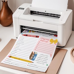 May include: A white printer printing two sheets of paper. One sheet is a "Favorites" list with prompts for color, snack, and more. The other is a "Classroom Wish List." Both sheets have colorful graphics and text.