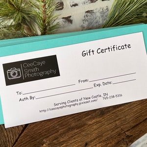 May include: A white gift certificate with a black and white logo for CeeCaye Smith Photography. The certificate has fields for "To:", "Auth By:", "From:", and "Exp. Date:". The text "Serving Clients of New Castle, IN" and a website address and phone number are printed at the bottom.