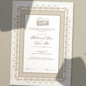 A wedding invitation with a decorative gold border and intricate patterns. The invitation features text in both English and Arabic script, with the names  prominently displayed. Additional details include the date, time, and location of the Nikah ceremony, along with a heartfelt message.