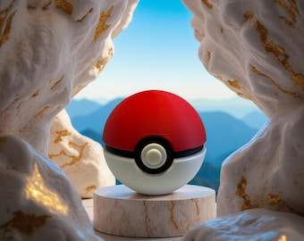 May include: A red and white Poké Ball with a black band and a white button, set against a backdrop of mountains and a blue sky. The ball is displayed on a small, round, marble-like pedestal, framed by textured, white rock formations.