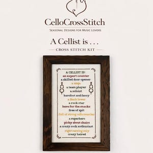 May include: Cross stitch kit with a framed design. The text reads "A Cellist is..." with humorous descriptions. The finished size is approx. 28 x 43 cm. The kit includes a printed pattern, pre-cut Aida fabric, and embroidery floss.