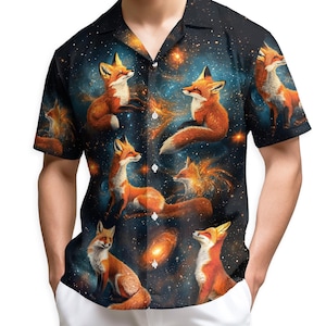 May include: Short-sleeved button-down shirt featuring a vibrant print of foxes set against a starry galaxy background. The shirt has a classic collar and a relaxed fit, perfect for casual wear. The foxes are depicted in shades of orange and white.
