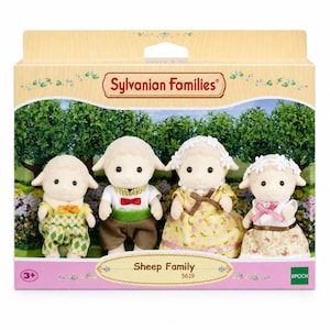 May include: A Sylvanian Families Sheep Family set in a cardboard box featuring four flocked sheep figurines. The figures wear detailed fabric clothing including patterned overalls, a shirt with a red bow tie, and floral dresses with white headbands.