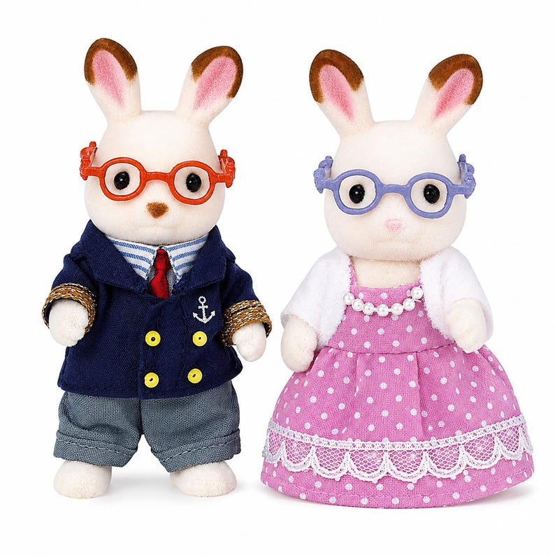 May include: Two flocked rabbit figurines. The left figure wears orange glasses, a navy blue blazer with gold buttons and an anchor emblem, a striped shirt, a red tie, and gray trousers. The right figure wears purple glasses, a white cardigan, and a pink polka-dot dress with a white lace trim and a pearl necklace.