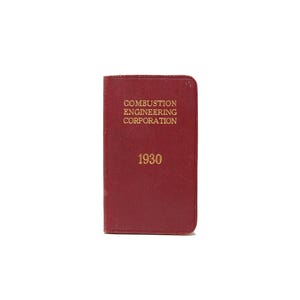 May include: A red book with the text "Combustion Engineering Corporation" and "1930" on the cover.