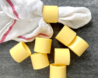 Butter yellow melamine napkin rings - set of 8 - 1980s vintage