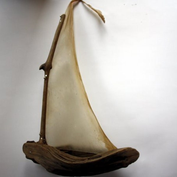 driftwood sailboat with parchment