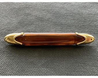 Vintage signed Monet amber-colored lucite centerpiece gold tone bar brooch