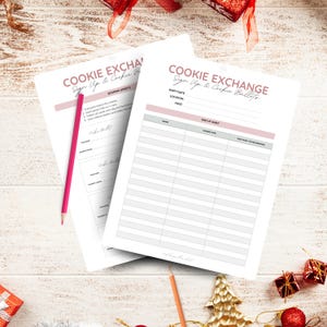May include: Two white Cookie Exchange sign-up sheets with pink accents and text. One sheet includes scoring instructions. A pink pencil rests on the left sheet. The sheets are on a light wood surface with Christmas decorations.