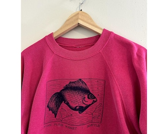 Sudadera raglán vintage de los años 80 y 90 con estampado de pescado del mercado Pike Place de Seattle, talla M para hombre.
