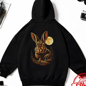 May include: A white ceramic mug with a black handle and the text "But First, Coffee" in a handwritten style. The mug is on a white surface. The mug is 4 inches tall.